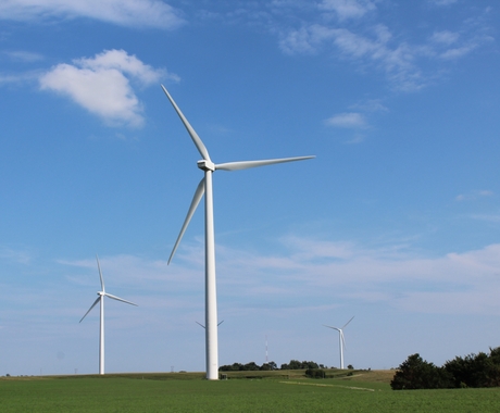 wind turbines in an open field.
