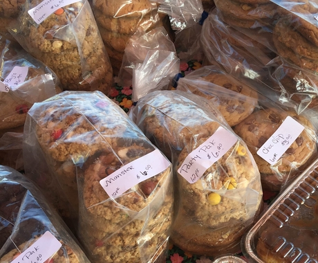 Packages of home-baked cookies at a farmers market