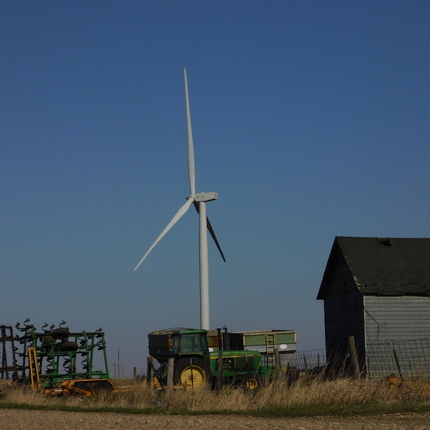 Wind turbine by farming equipment 