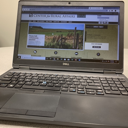 A laptop screen showing the Center's website