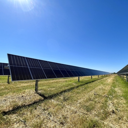 Solar arrays in a field 