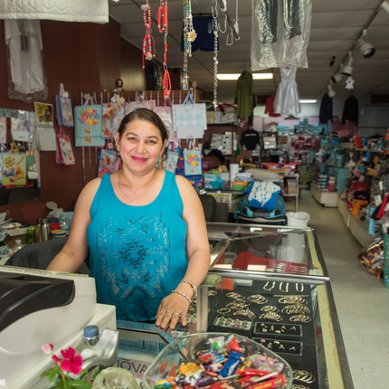 A Latino business owner in her shop